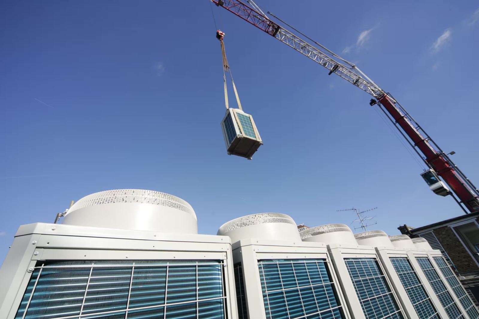 Cool Cats installing a commercial air conditioning condenser