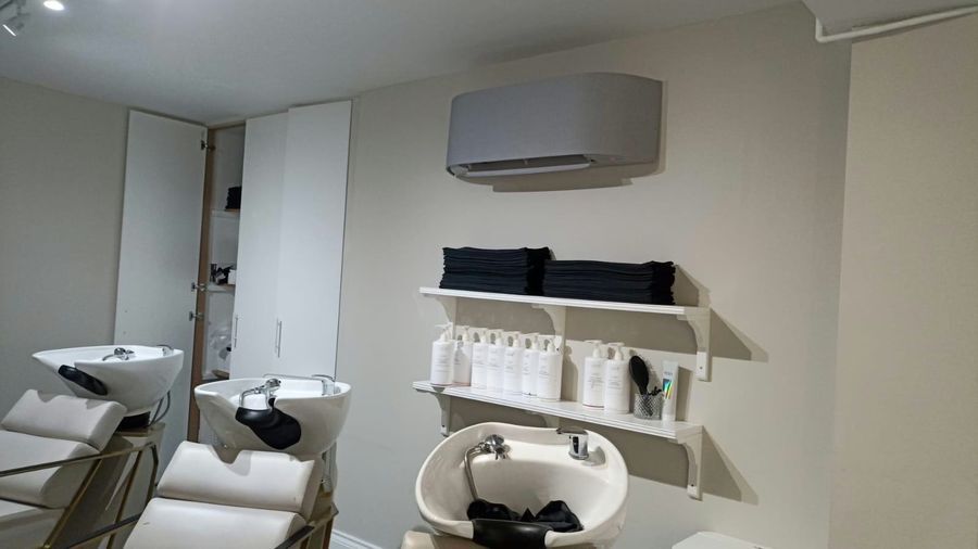 Wall-mounted air conditioning unit in a salon
